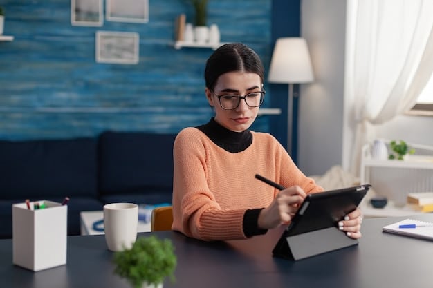 An individual sitting at a desk, looking at a tablet displaying a risk assessment questionnaire with options ranging from 