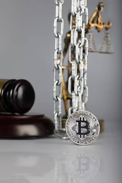 A gavel hitting a block with a Bitcoin symbol engraved on it. The background is a blurred image of the US Capitol building, symbolizing the legal and regulatory environment surrounding cryptocurrencies in the US. The image is professional and serious in tone.